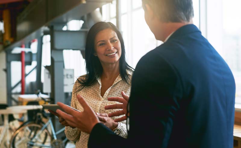 Photo of two people having a conversation